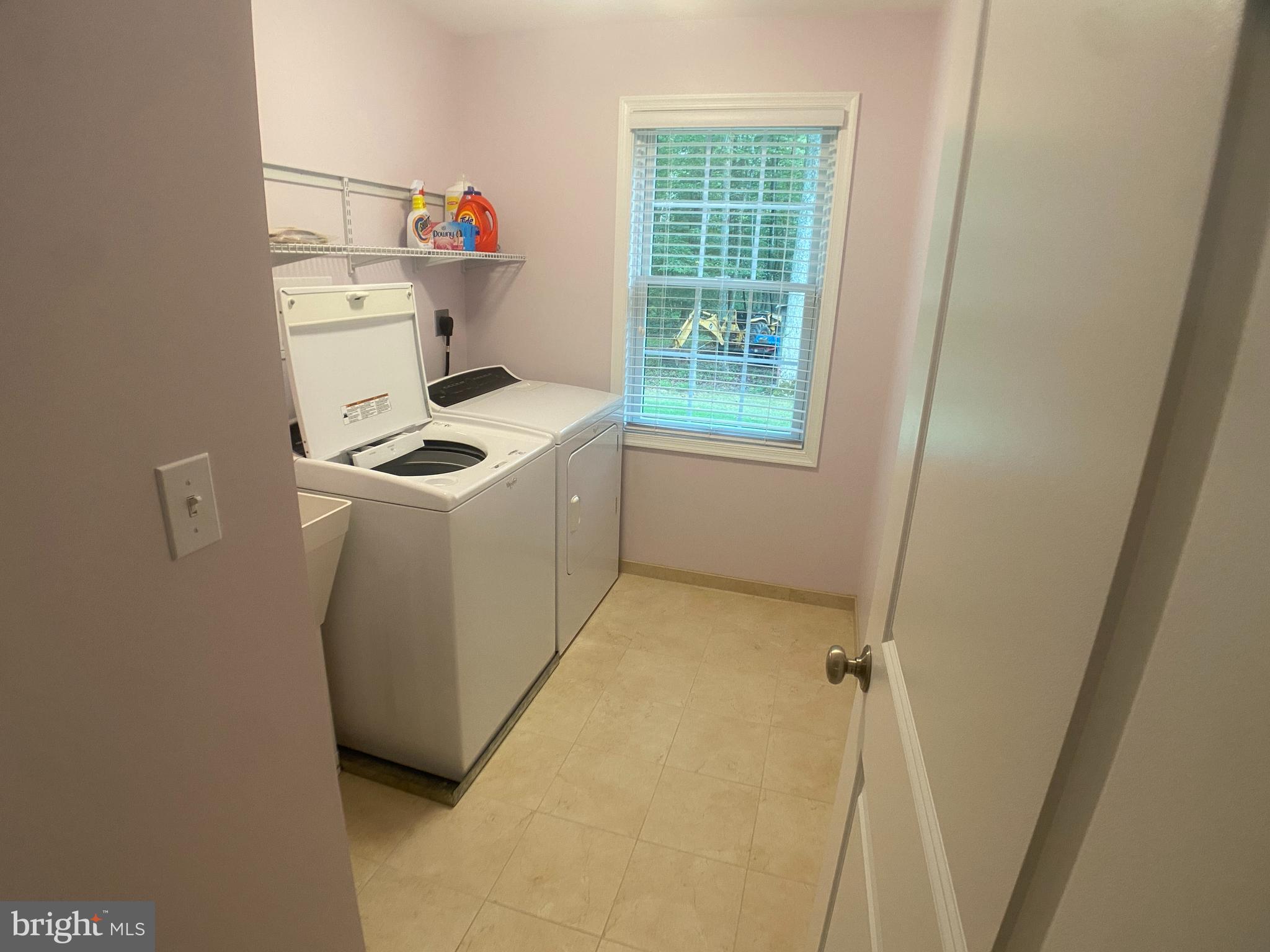 4740 Ford Fields Road Myersville, MD 21773 - Photo 64 of 147 a storage room with washer and dryer