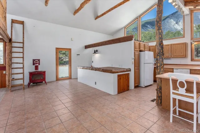 a kitchen with stainless steel appliances a stove a sink and a refrigerator