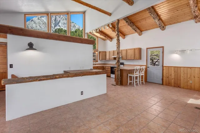 a kitchen with stainless steel appliances granite countertop a stove and a refrigerator