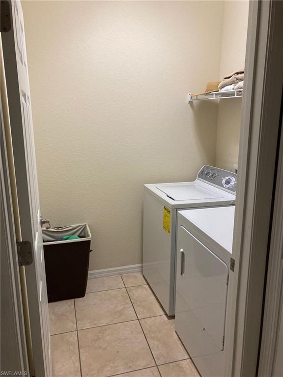 21334 Bella Terra Boulevard Estero, FL 33928 - Photo 15 of 30 a utility room with dryer and washer