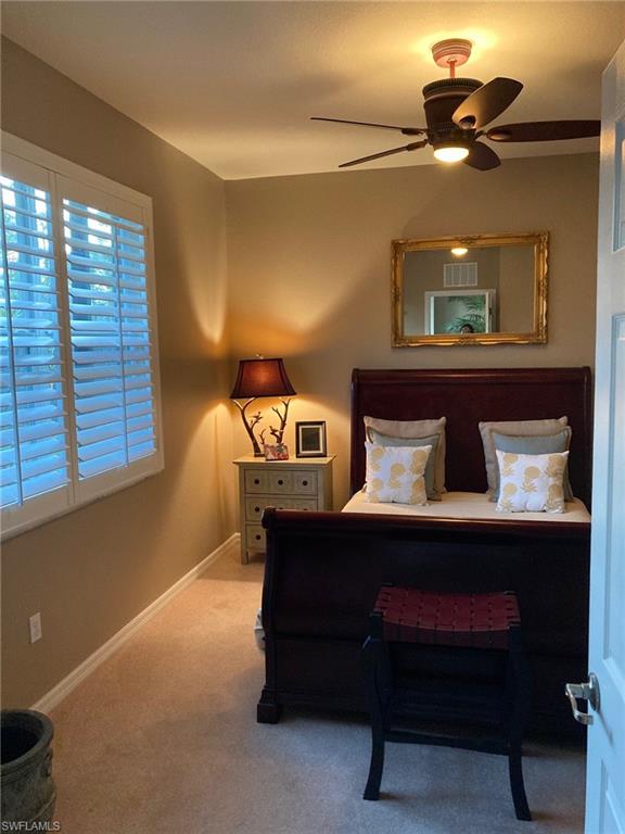 21334 Bella Terra Boulevard Estero, FL 33928 - Photo 16 of 30 a bed room with a bed and a window