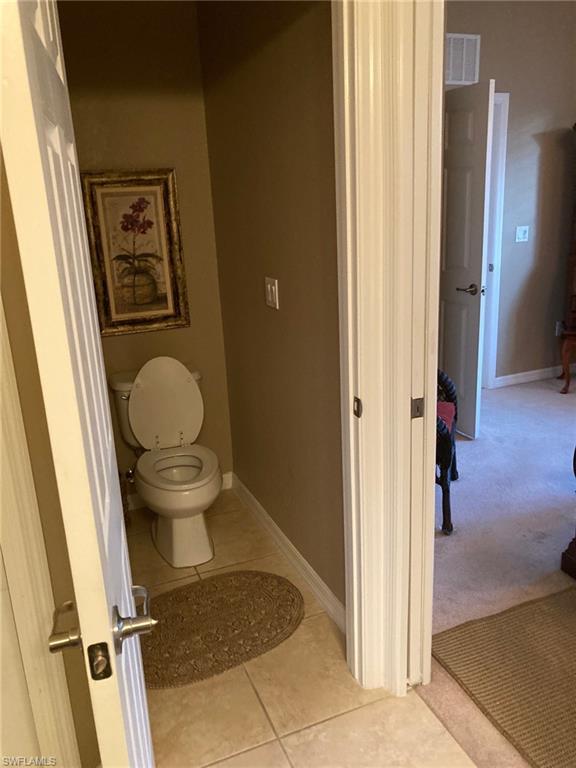 21334 Bella Terra Boulevard Estero, FL 33928 - Photo 19 of 30 a bathroom with a toilet and a shower