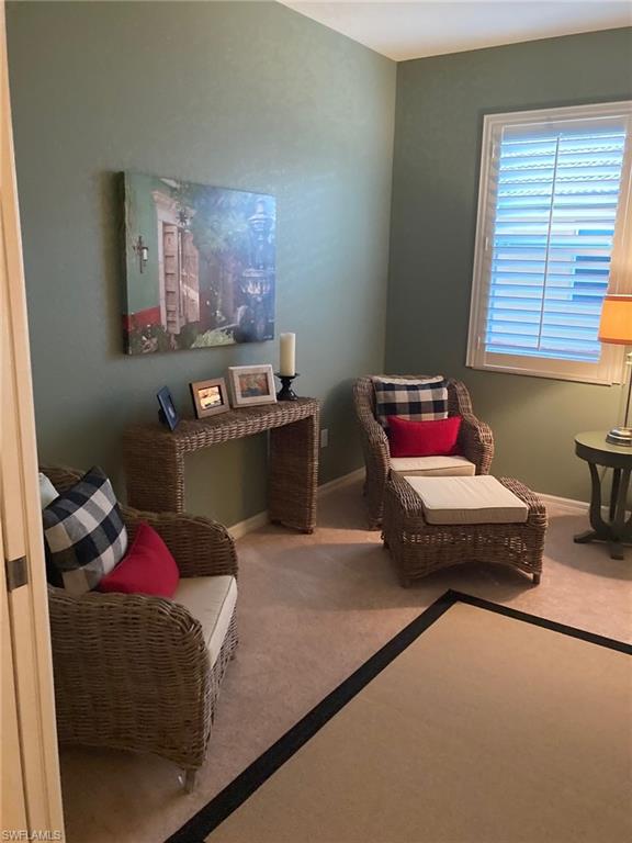 21334 Bella Terra Boulevard Estero, FL 33928 - Photo 23 of 30 a bedroom with a bed and a couch