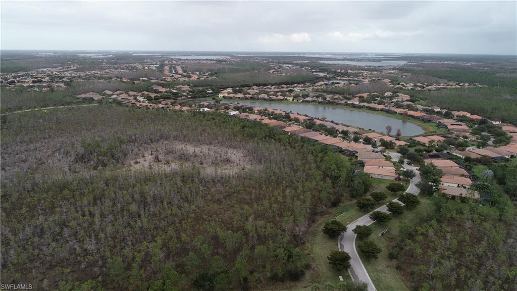 21334 Bella Terra Boulevard Estero, FL 33928 - Photo 25 of 30 an aerial view of residential building and ocean
