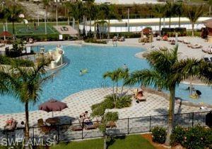 21334 Bella Terra Boulevard Estero, FL 33928 - Photo 28 of 30 a row of palm trees and yard