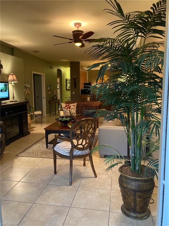 21334 Bella Terra Boulevard Estero, FL 33928 - Photo 8 of 30 a living room with furniture and a potted plant