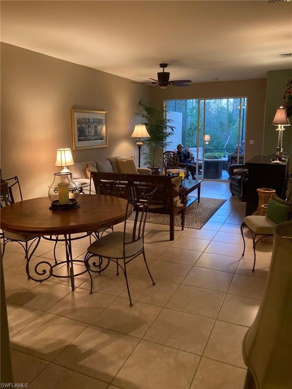 21334 Bella Terra Boulevard Estero, FL 33928 - Photo 9 of 30 a living room with fireplace furniture and a large window