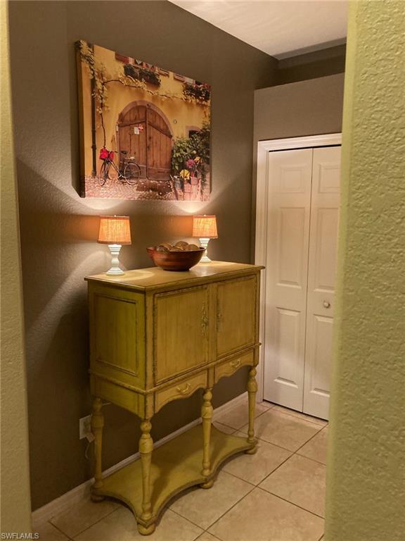 21334 Bella Terra Boulevard Estero, FL 33928 - Photo 10 of 30 a room with water heater and wooden cabinets