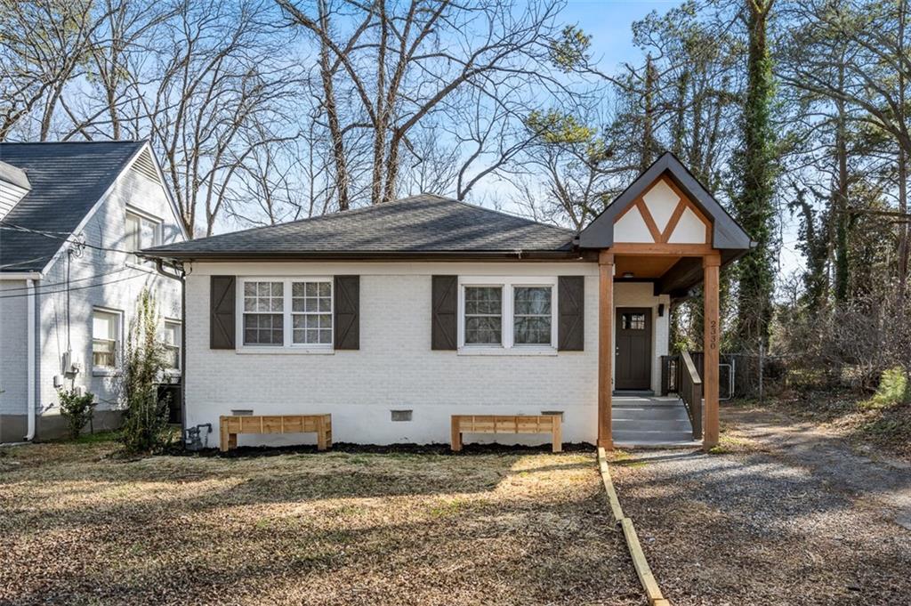 a house with trees in front of it
