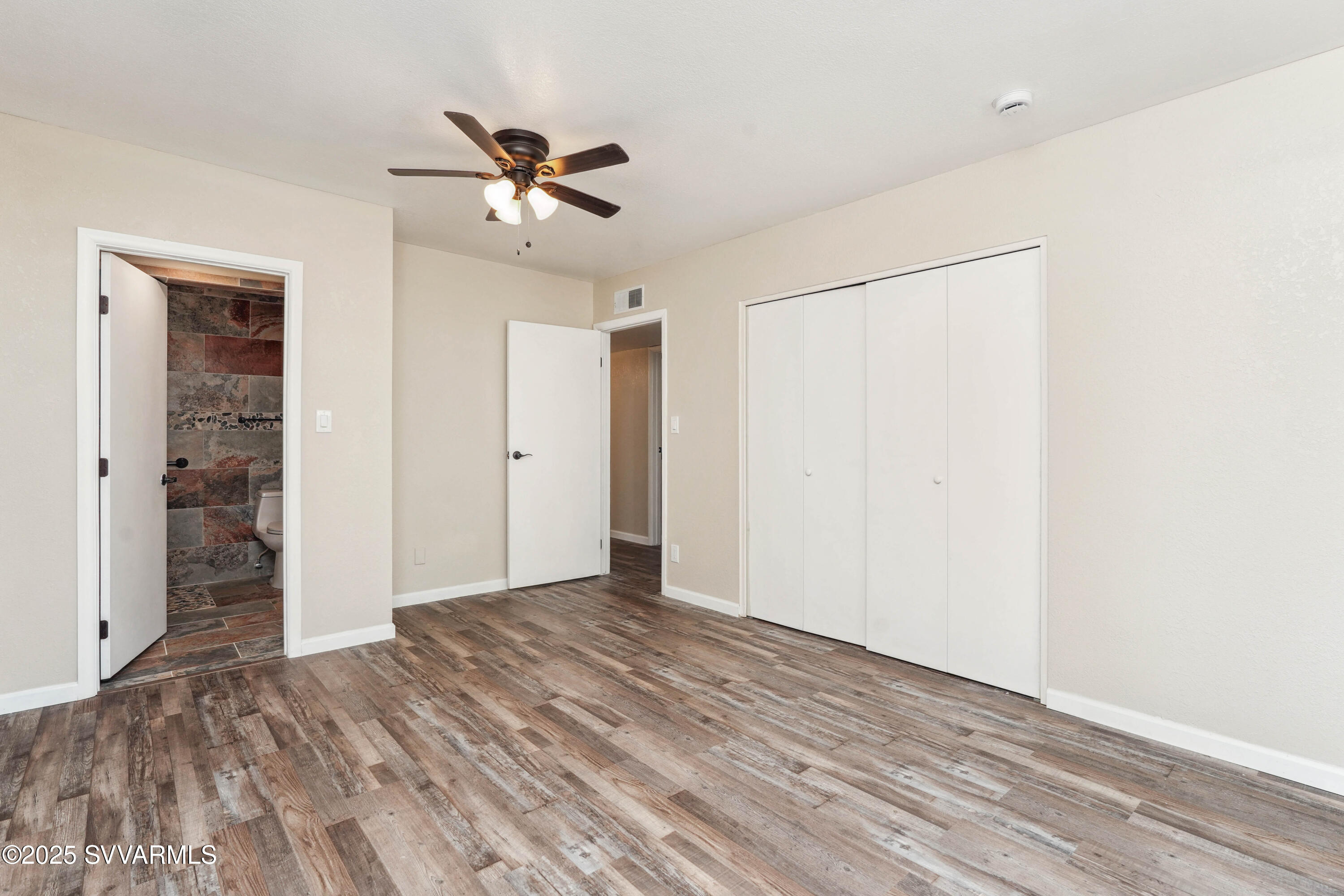248 South River Cave Road Camp Verde, AZ 86322 - Photo 13 of 36 a view of empty room with wooden floor
