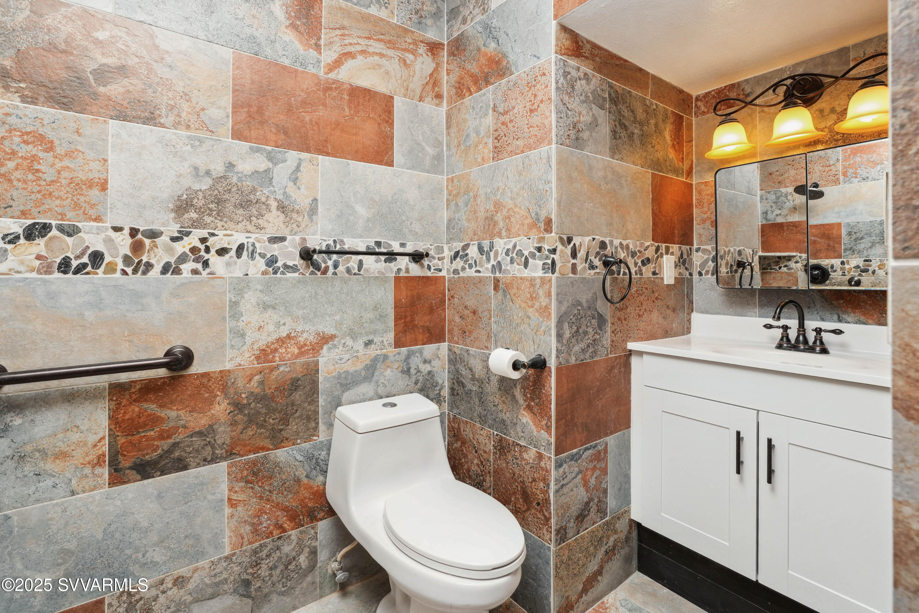 248 South River Cave Road Camp Verde, AZ 86322 - Photo 14 of 36 a bathroom with a toilet sink and mirror