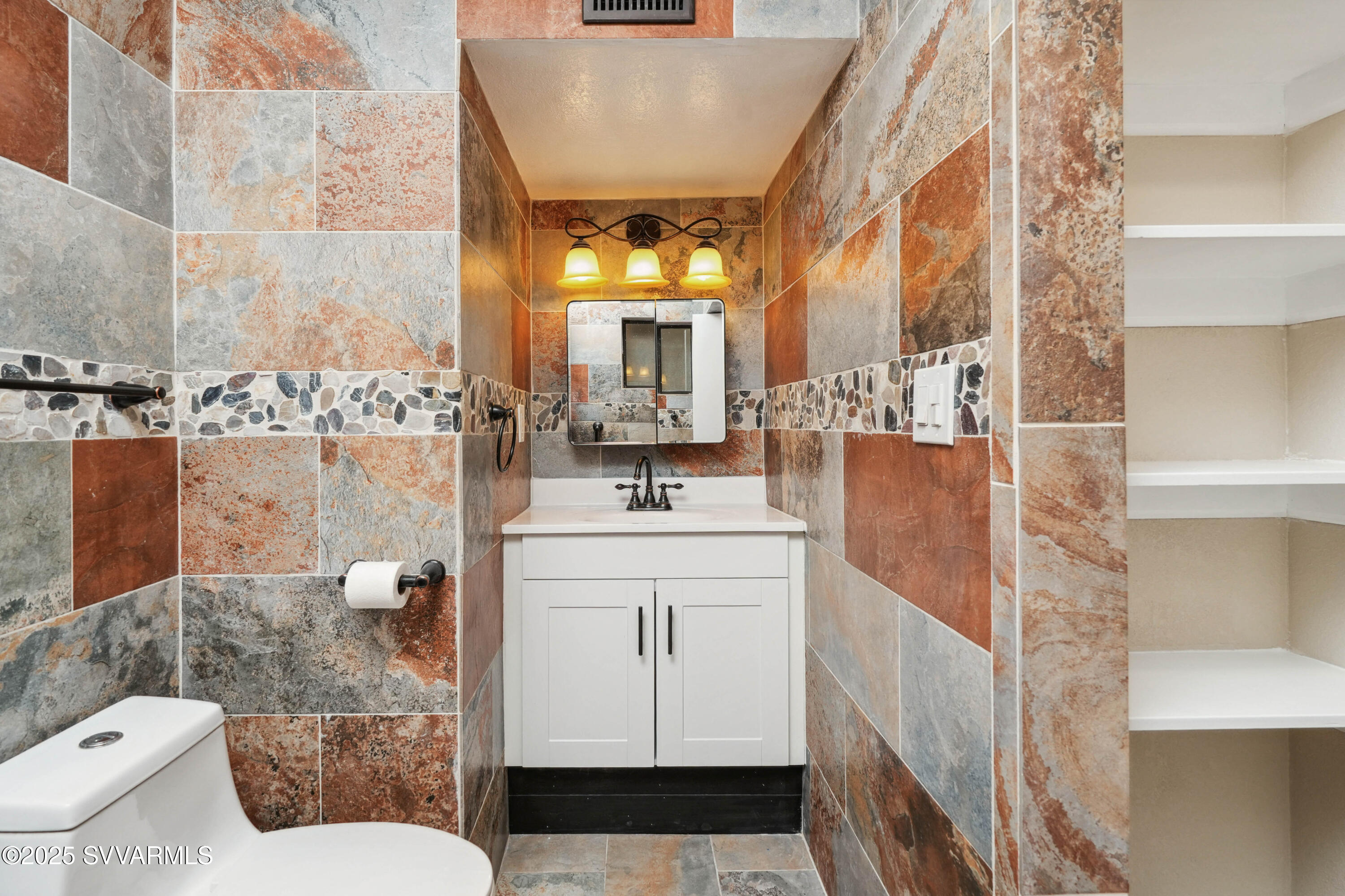 248 South River Cave Road Camp Verde, AZ 86322 - Photo 15 of 36 a bathroom with a sink a toilet and shower