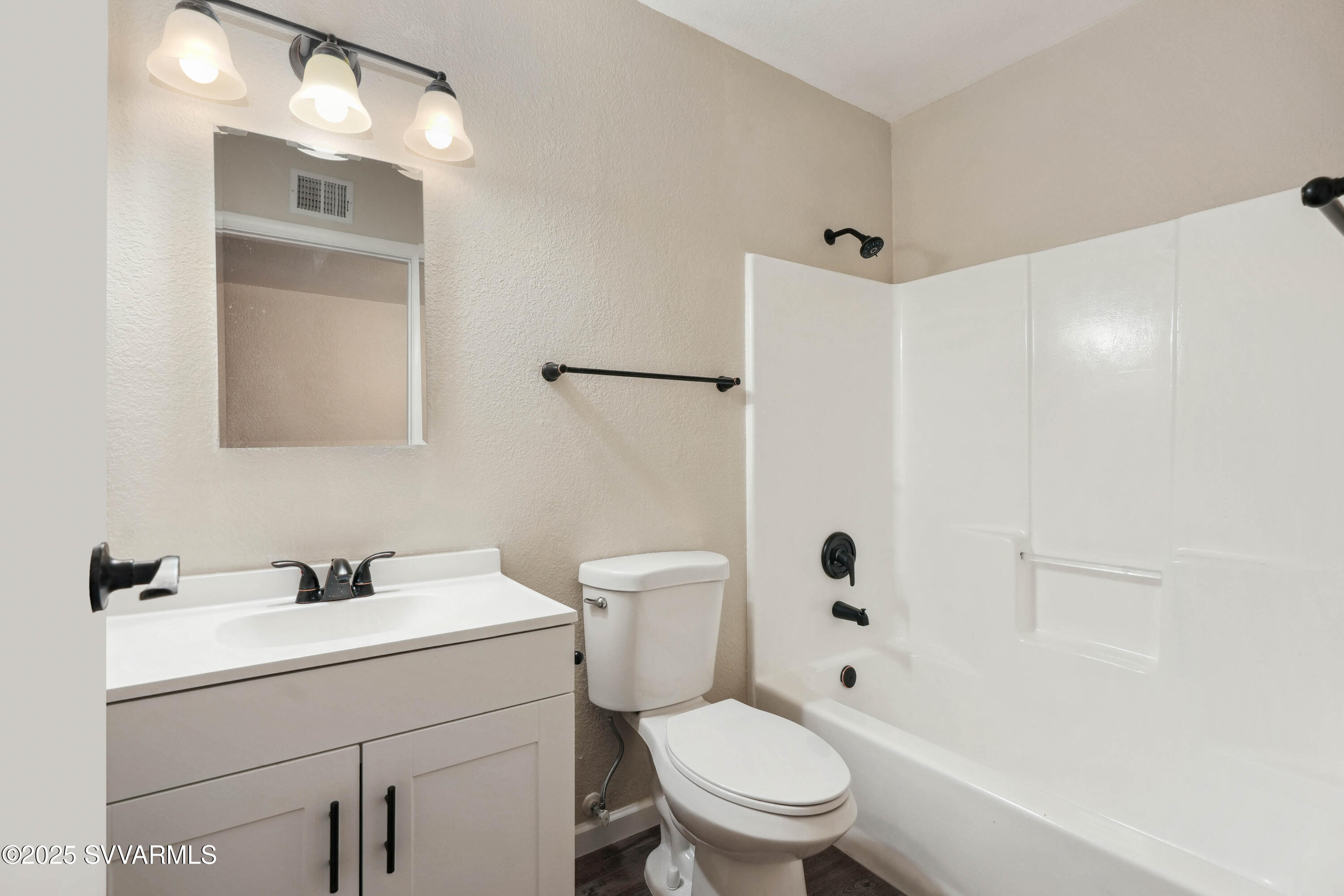 248 South River Cave Road Camp Verde, AZ 86322 - Photo 19 of 36 a white toilet sitting next to a bathroom sink