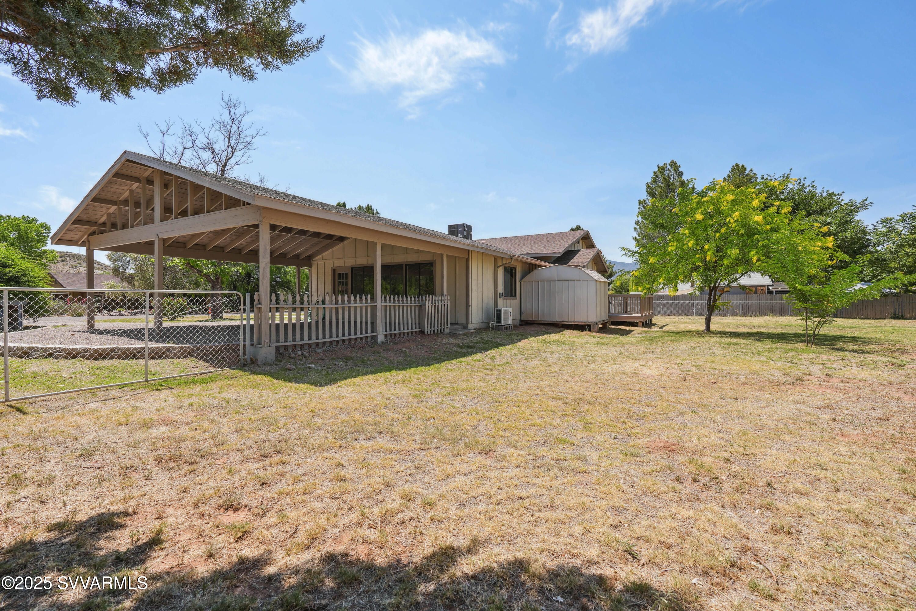 248 South River Cave Road Camp Verde, AZ 86322 - Photo 31 of 36 a house with swimming pool in front of it