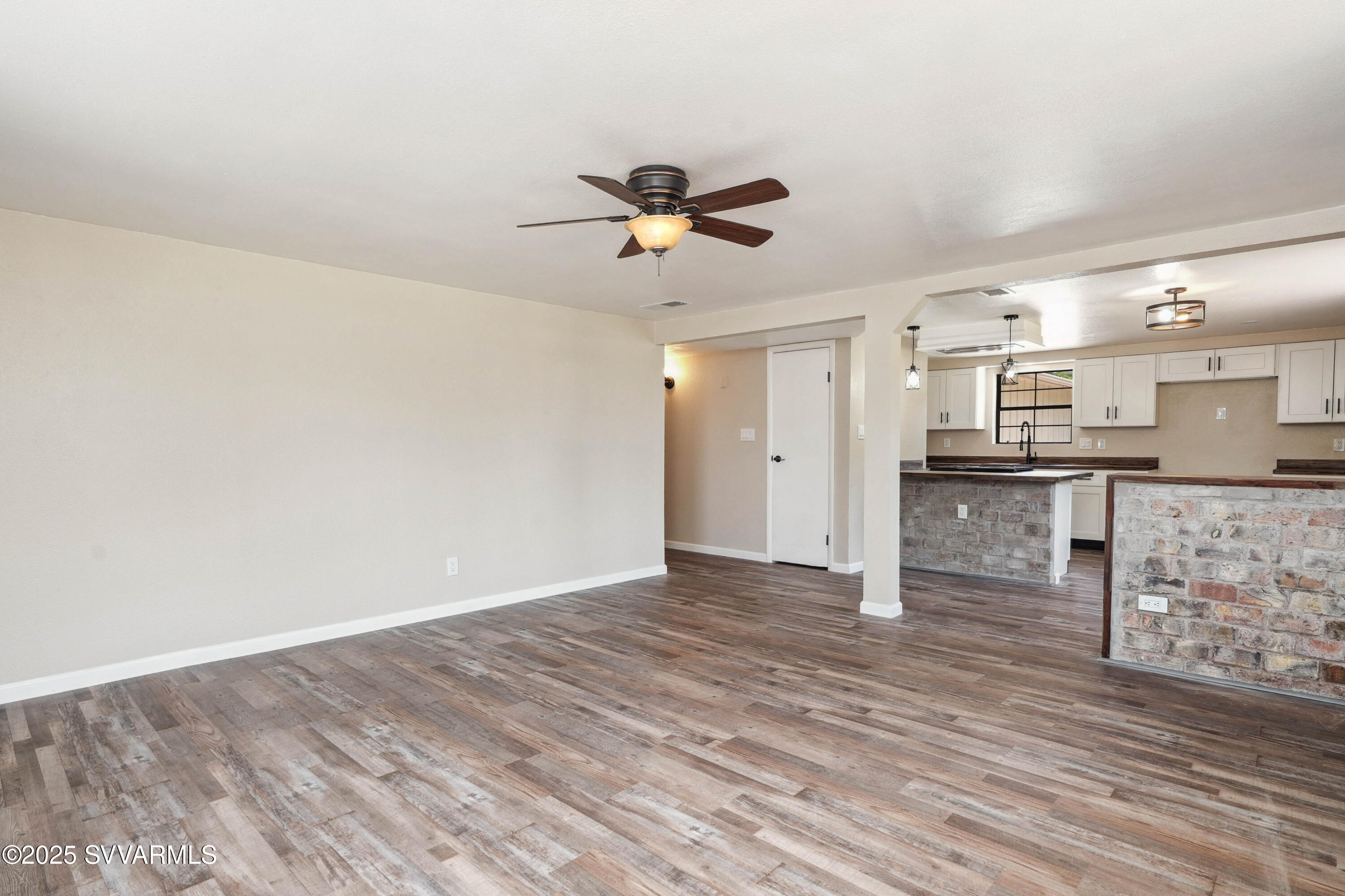 248 South River Cave Road Camp Verde, AZ 86322 - Photo 6 of 36 a view of a kitchen with a sink and a refrigerator