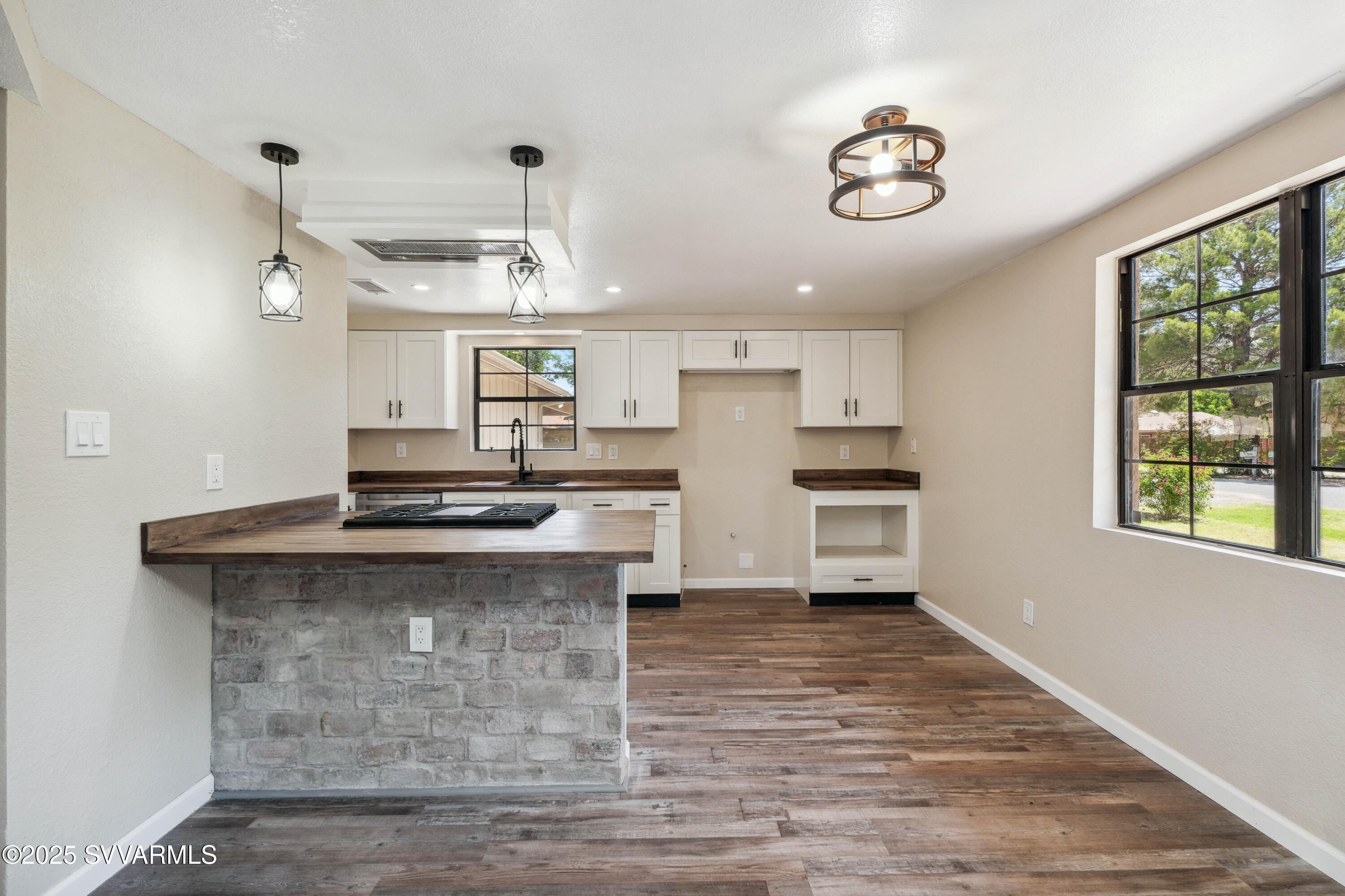 248 South River Cave Road Camp Verde, AZ 86322 - Photo 8 of 36 a kitchen with stainless steel appliances granite countertop a stove and a refrigerator