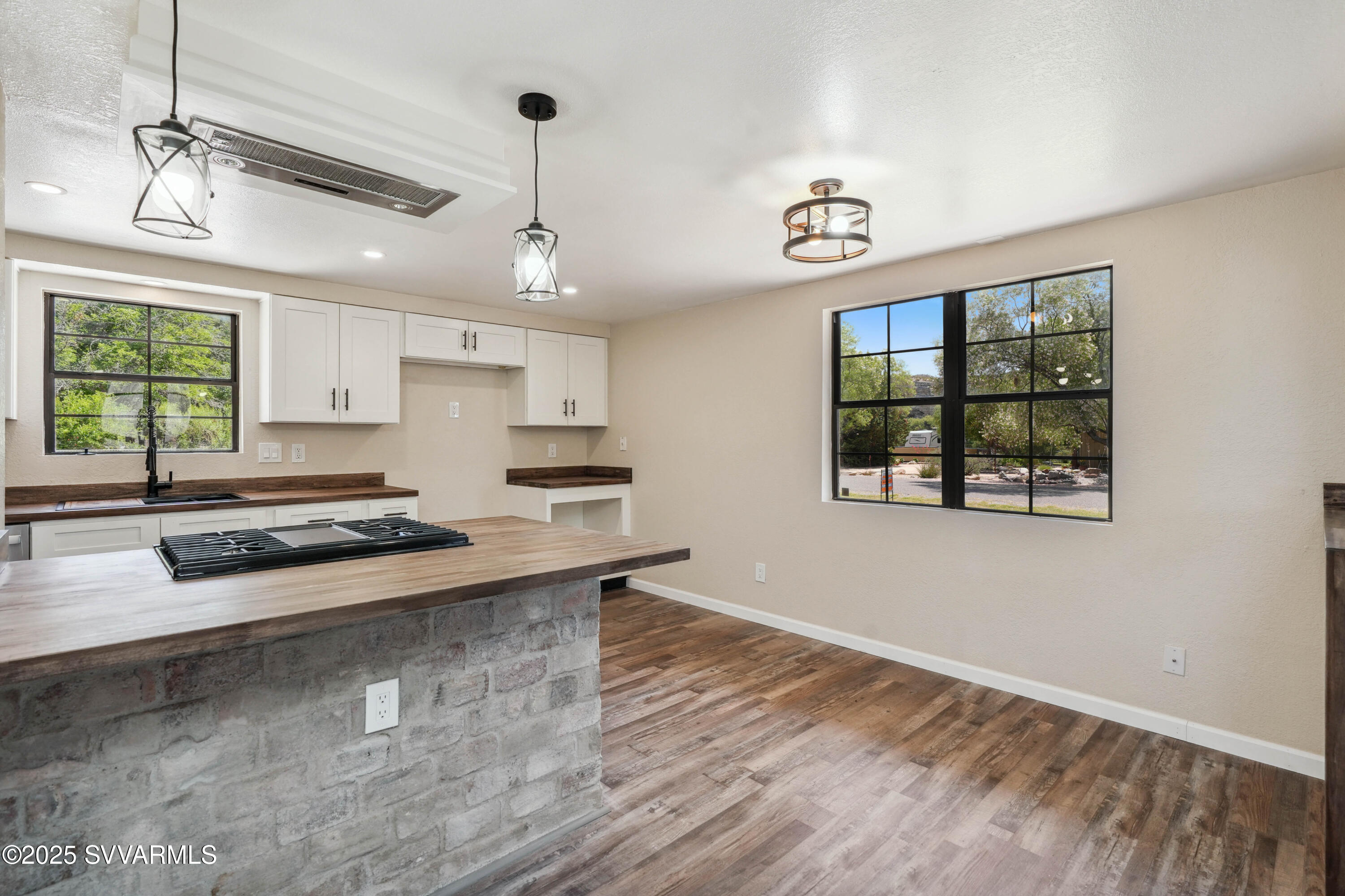 248 South River Cave Road Camp Verde, AZ 86322 - Photo 9 of 36 a kitchen with stainless steel appliances granite countertop a stove a sink and a window