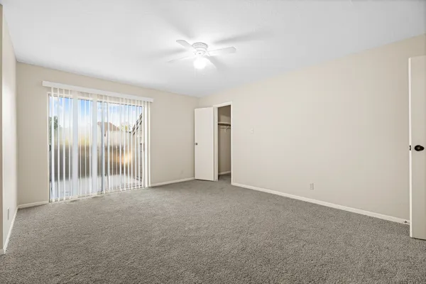 a view of an empty room with a window