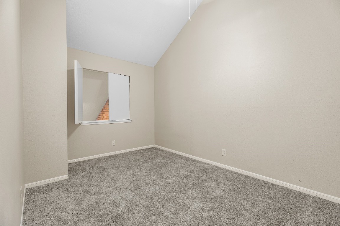 304 East Adoue Street Alvin, TX 77511 - Photo 8 of 12 an empty room with windows
