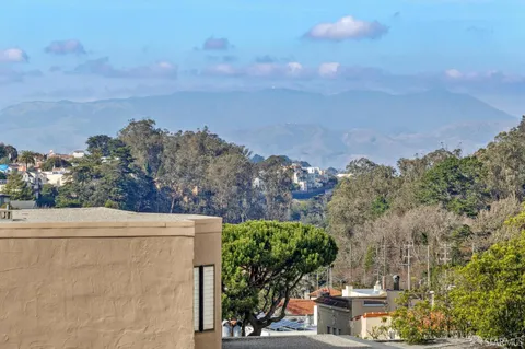 a living room with fireplace furniture and a fireplace