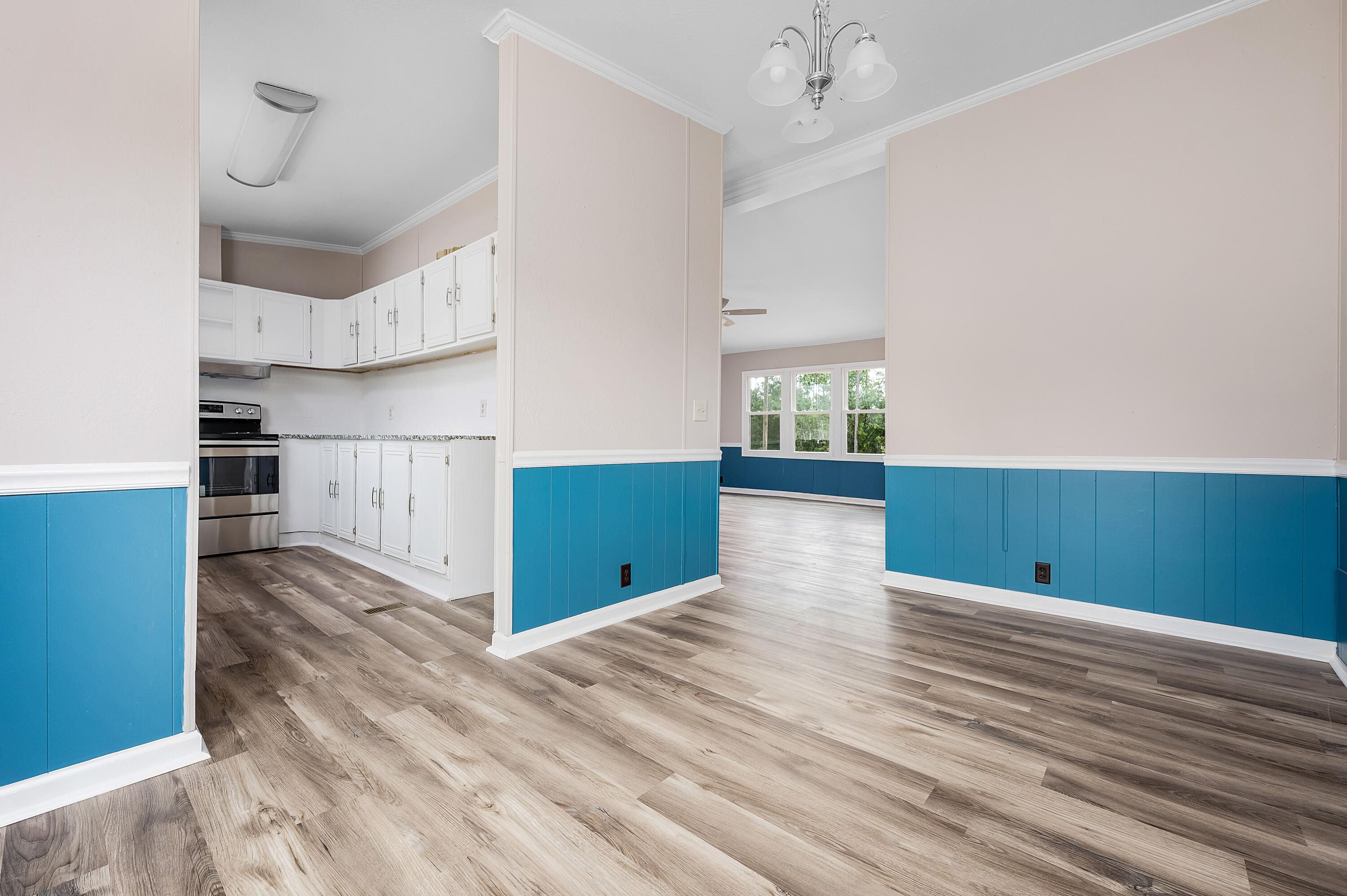 4625 Canary Way Crestview, FL 32539 - Photo 14 of 40 a view of kitchen and kitchen with wooden floor