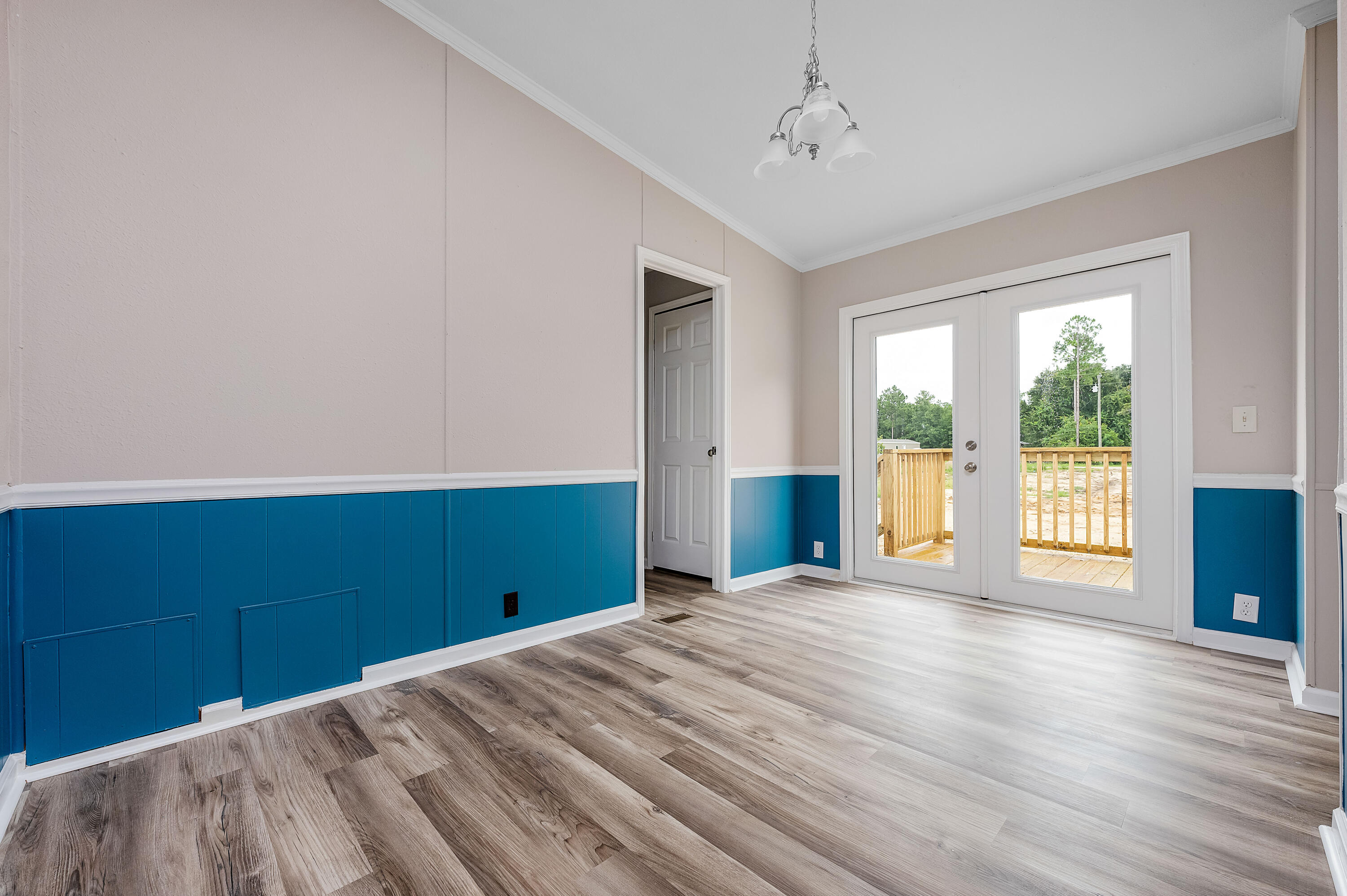 4625 Canary Way Crestview, FL 32539 - Photo 16 of 40 a view of empty room with wooden floor and fan