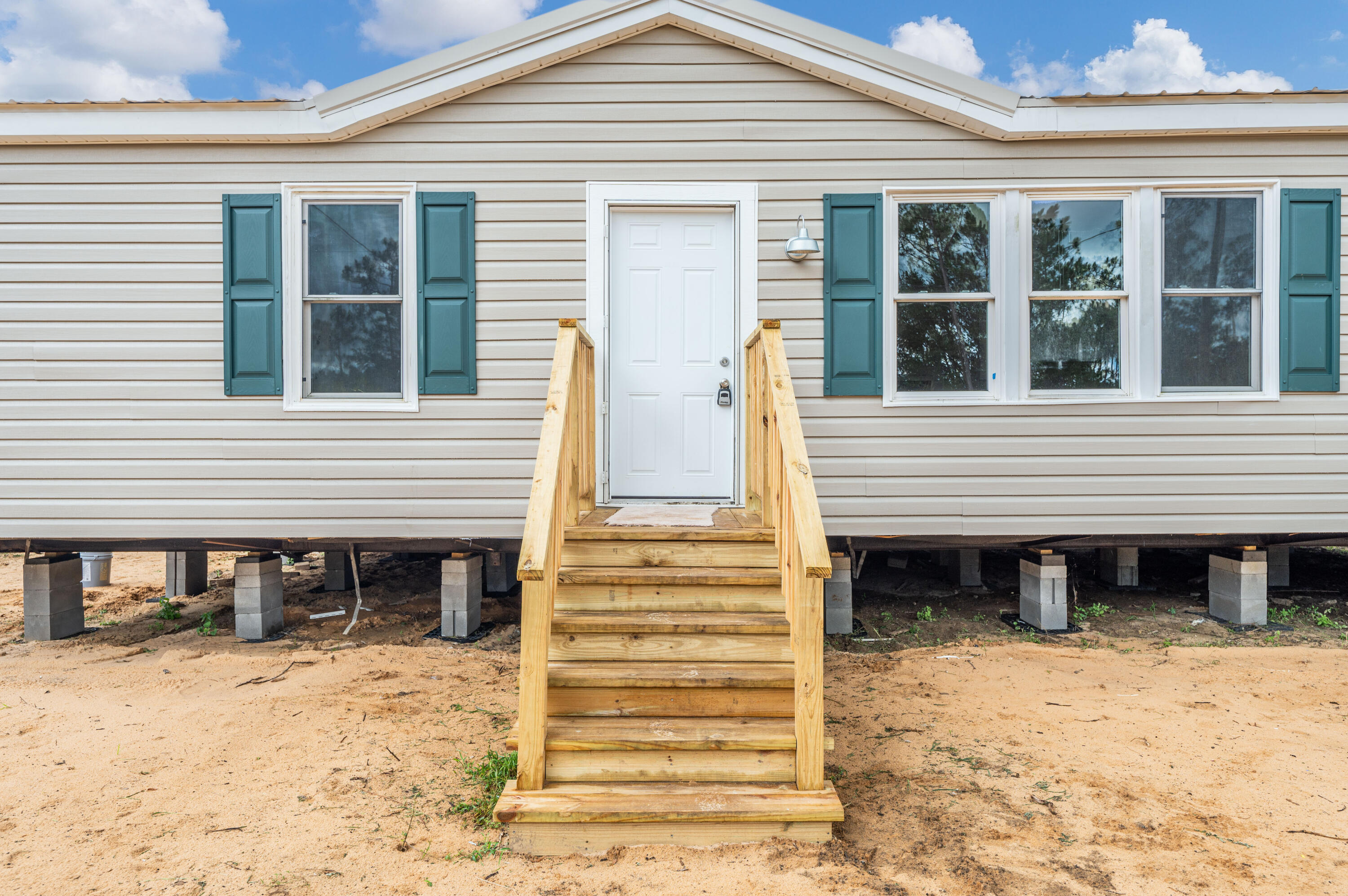 4625 Canary Way Crestview, FL 32539 - Photo 2 of 40 a view of a house with a yard and balcony