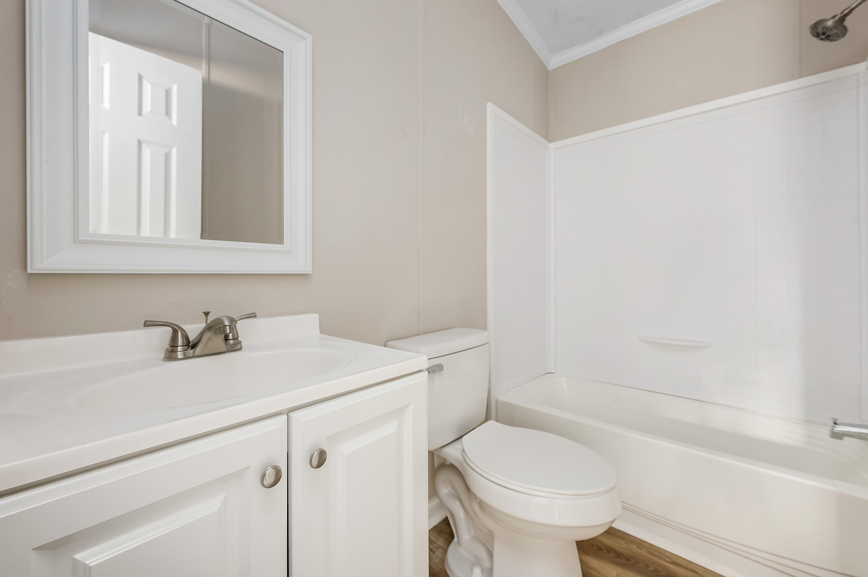 4625 Canary Way Crestview, FL 32539 - Photo 29 of 40 a bathroom with a sink toilet vanity and tub