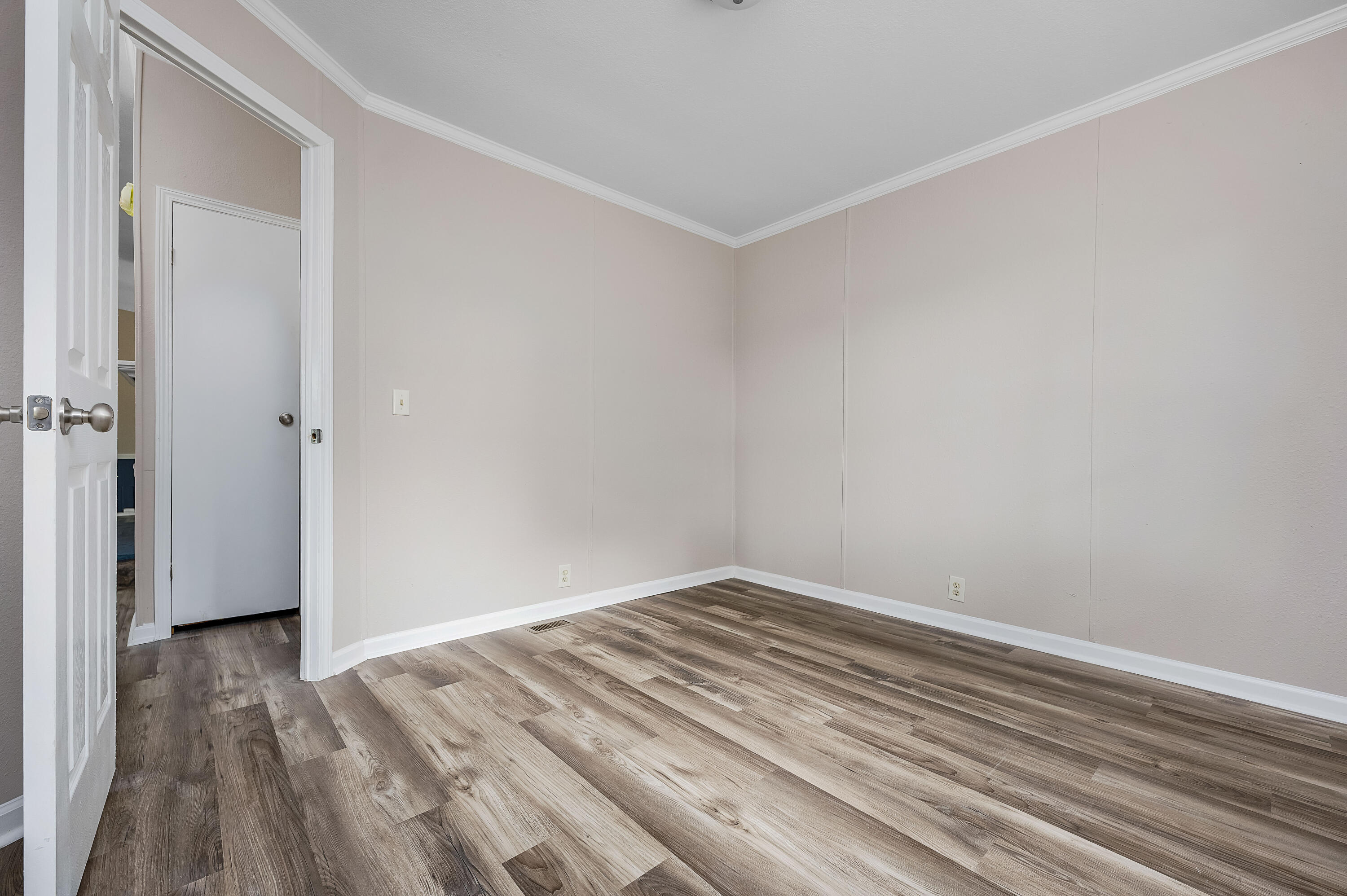 4625 Canary Way Crestview, FL 32539 - Photo 33 of 40 a view of a room with wooden floor and closet