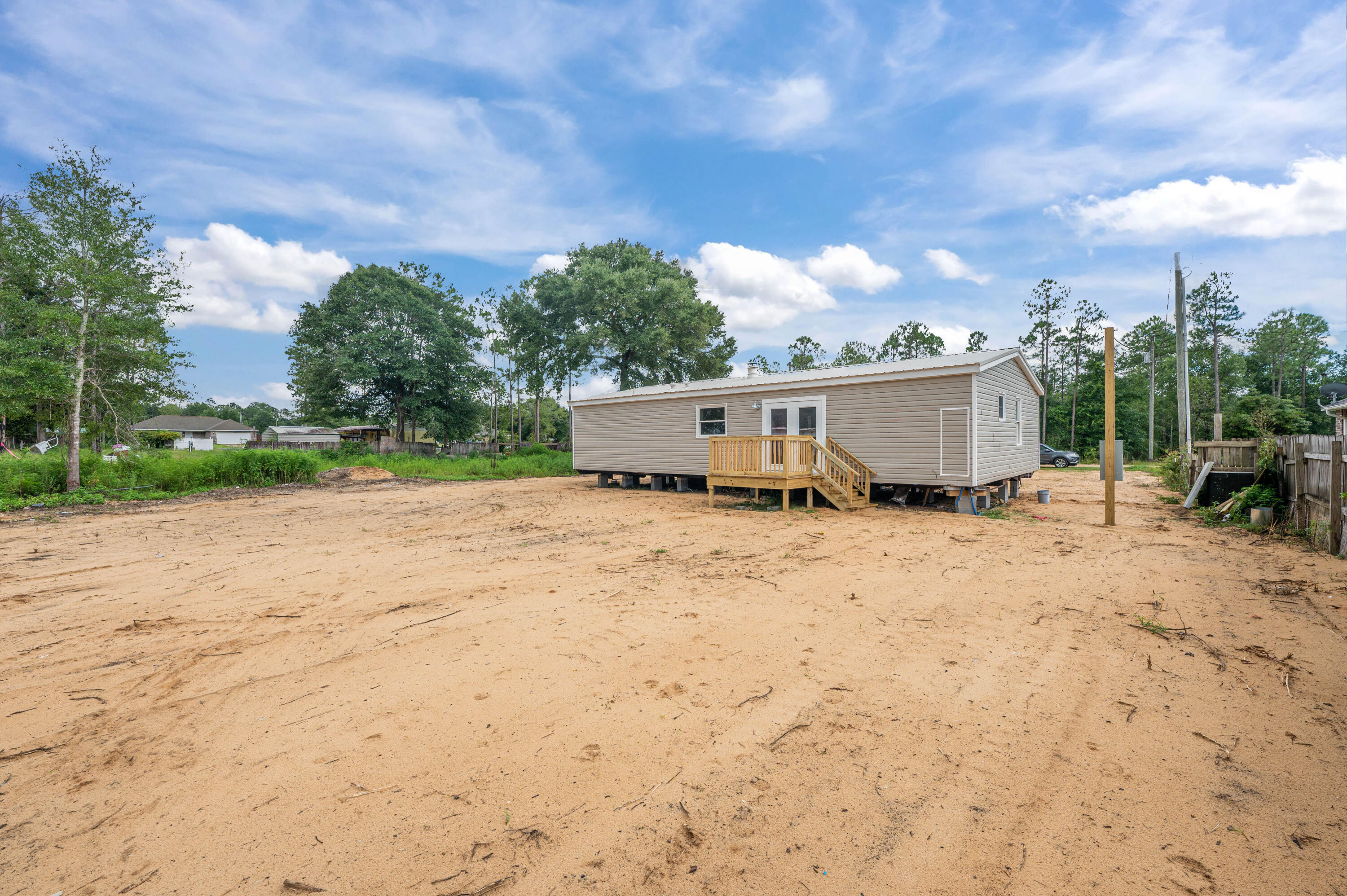 4625 Canary Way Crestview, FL 32539 - Photo 39 of 40 a view of a house with backyard and sitting area