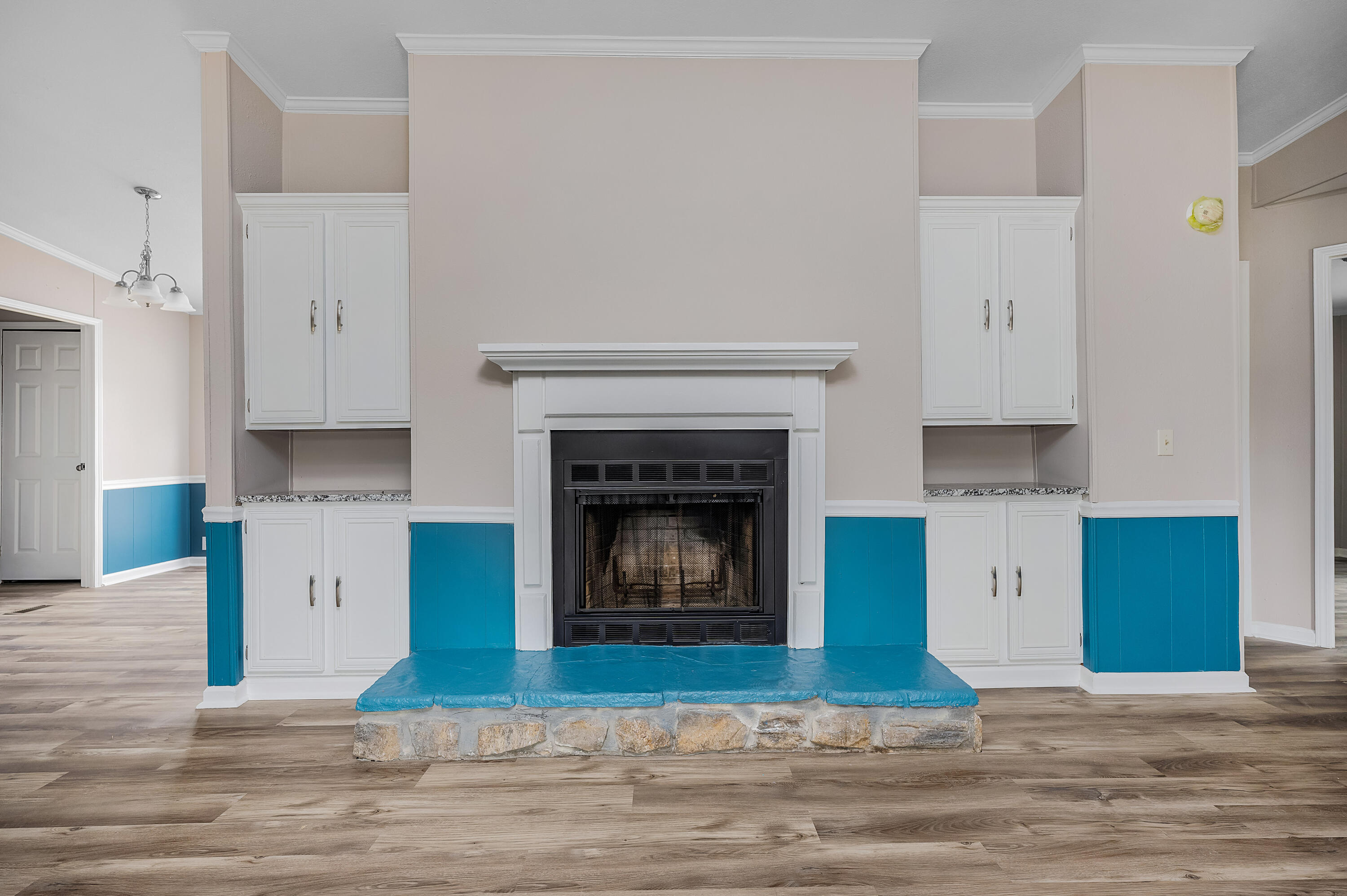 4625 Canary Way Crestview, FL 32539 - Photo 7 of 40 a living room with a fireplace and a large window