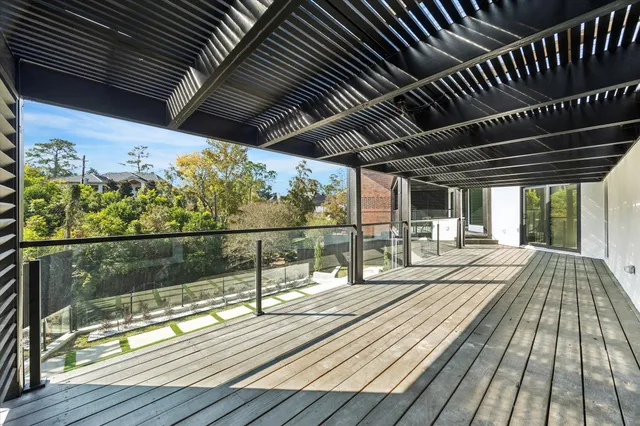 a view of a balcony with wooden floor