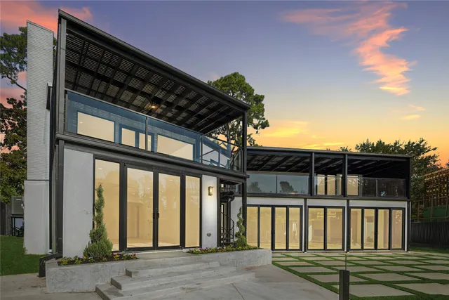 a balcony with wooden floor and furniture
