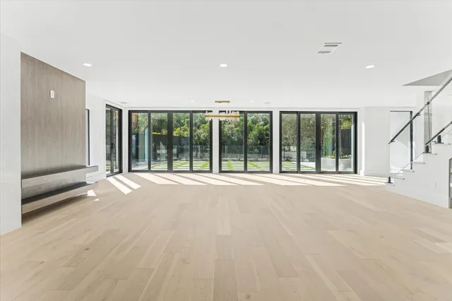 a view of an empty room with a sliding door