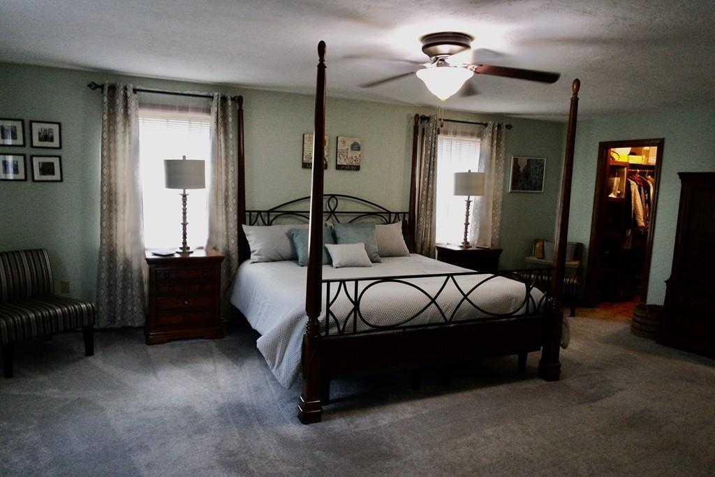 6 Crestlan Drive Worcester, MA 01604 - Photo 22 of 41 a bedroom with bed and a chandelier