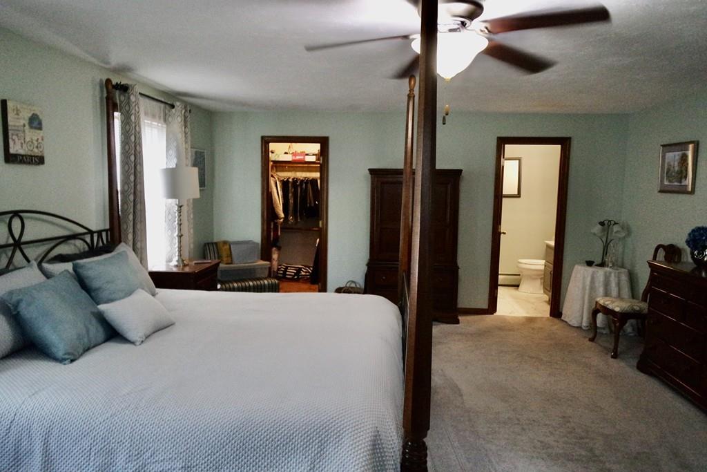 6 Crestlan Drive Worcester, MA 01604 - Photo 23 of 41 a bedroom with a bed and a chandelier