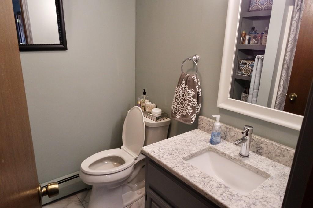 6 Crestlan Drive Worcester, MA 01604 - Photo 25 of 41 a bathroom with a granite countertop toilet sink and mirror