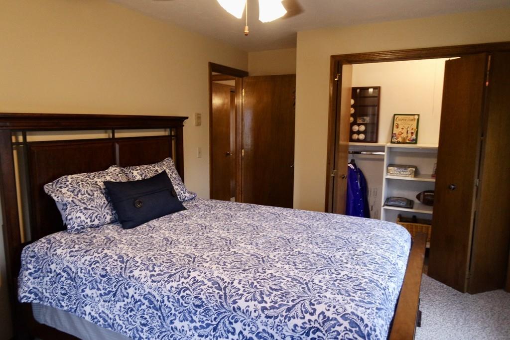 6 Crestlan Drive Worcester, MA 01604 - Photo 30 of 41 a bed sitting in a bedroom and a mirror