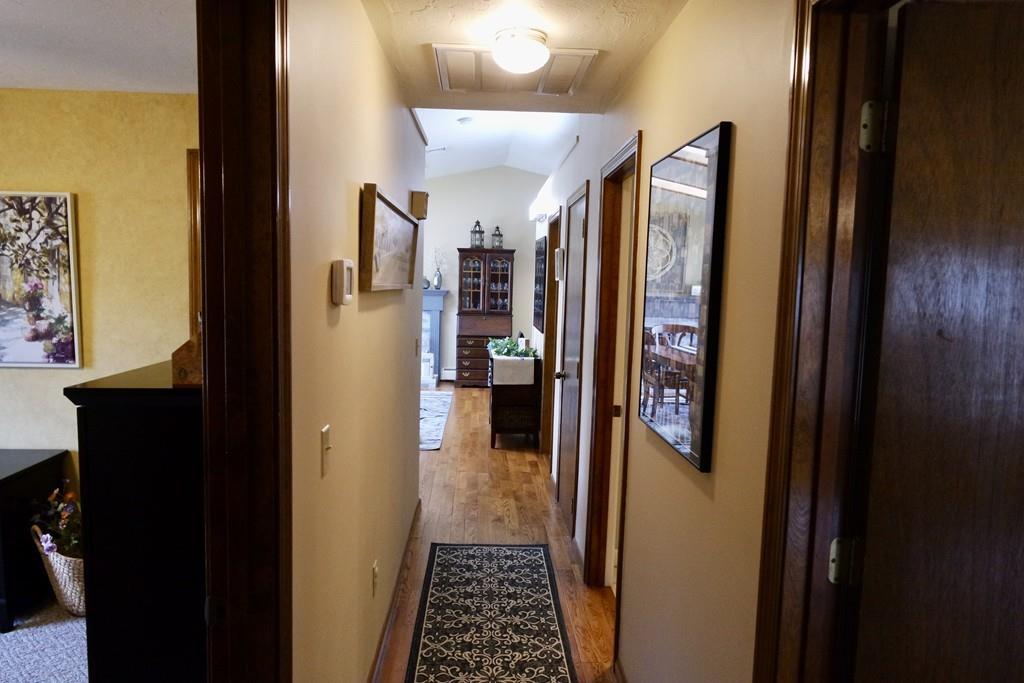 6 Crestlan Drive Worcester, MA 01604 - Photo 33 of 41 a view of a hallway with wooden floor and a bathroom