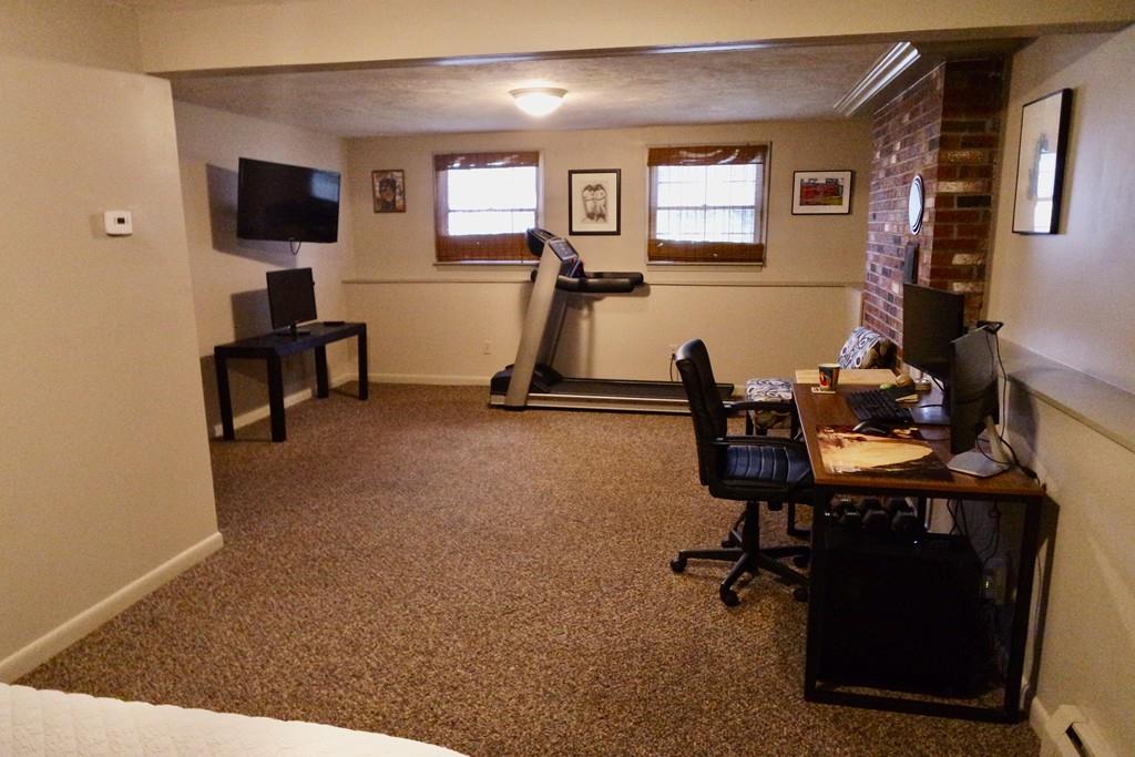 6 Crestlan Drive Worcester, MA 01604 - Photo 34 of 41 a room with gym equipment and a flat screen tv