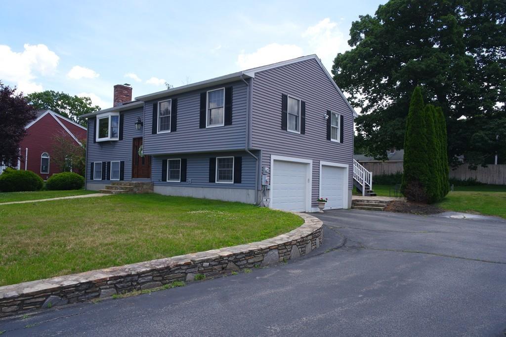 6 Crestlan Drive Worcester, MA 01604 - Photo 4 of 41 a front view of a house with a garden and yard
