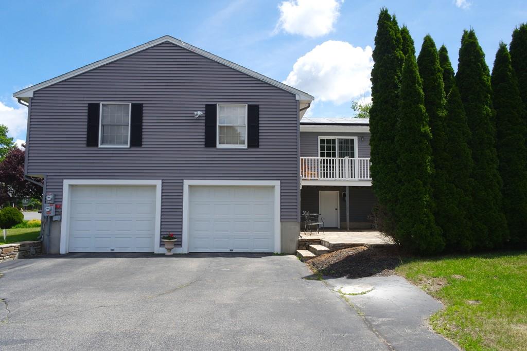 6 Crestlan Drive Worcester, MA 01604 - Photo 5 of 41 a front view of a house with a yard and garage