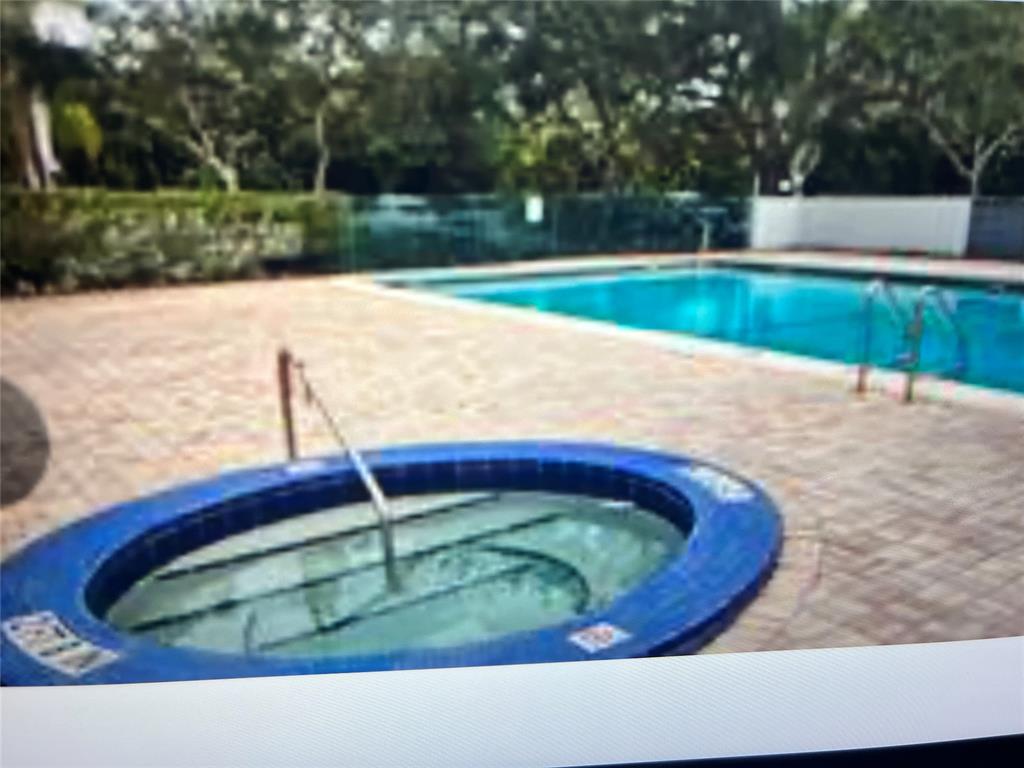 a view of swimming pool with a yard
