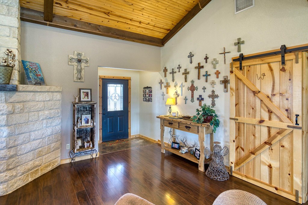 6446 Blackjack Road Fredonia, TX 76842 - Photo 20 of 52 a living room with furniture and wooden floor