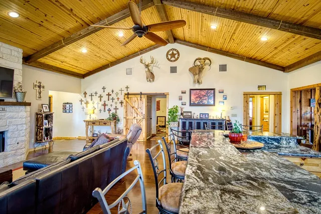 a kitchen with stainless steel appliances granite countertop a stove and a wooden cabinets