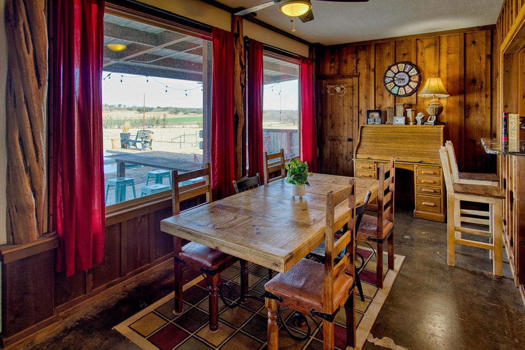 6446 Blackjack Road Fredonia, TX 76842 - Photo 29 of 52 a view of a dining room with furniture and window