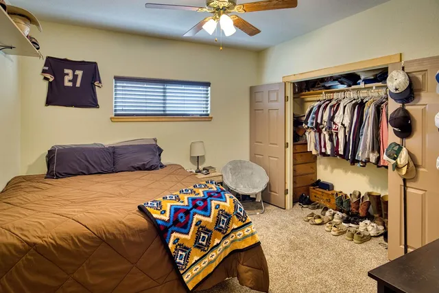 a bedroom with a bed and a couch