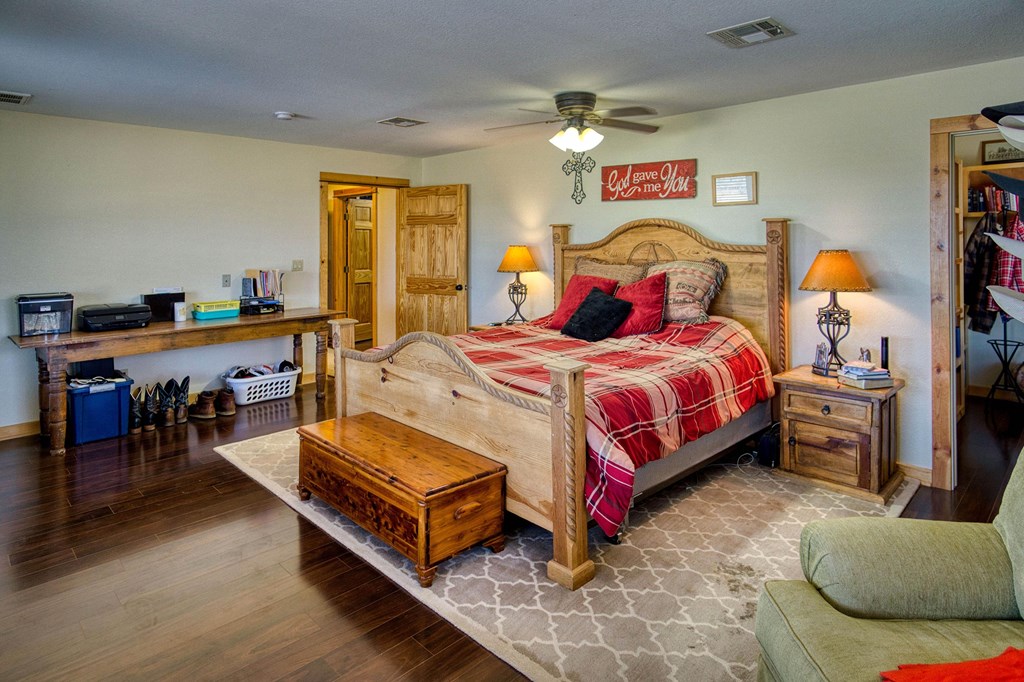 6446 Blackjack Road Fredonia, TX 76842 - Photo 38 of 52 a bedroom with a bed and a couch