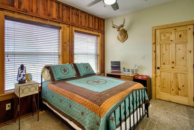 a spacious bathroom with a granite countertop sink and a mirror