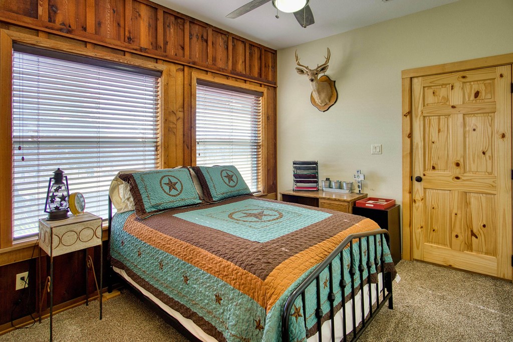 6446 Blackjack Road Fredonia, TX 76842 - Photo 47 of 52 a view of a bedroom with furniture and window